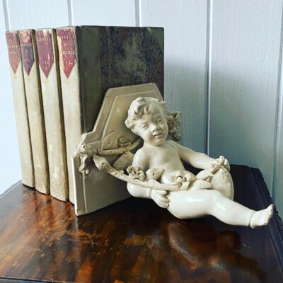 A Vintage French Ceramic Wall Bracket or Book End In The Form Of A Cherub