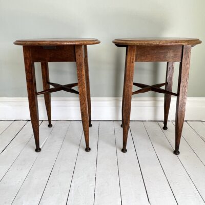 A Pair of Early C20th Oak Lamp or Display Tables by Harris & Sheldon