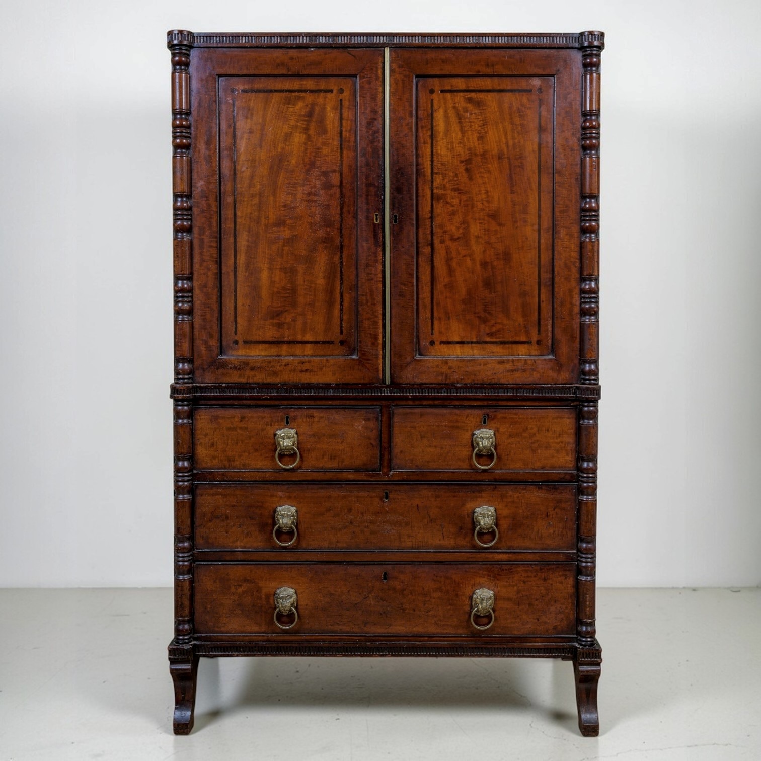 A Regency Mahogany Linen Press Of Rare Smaller Proportions